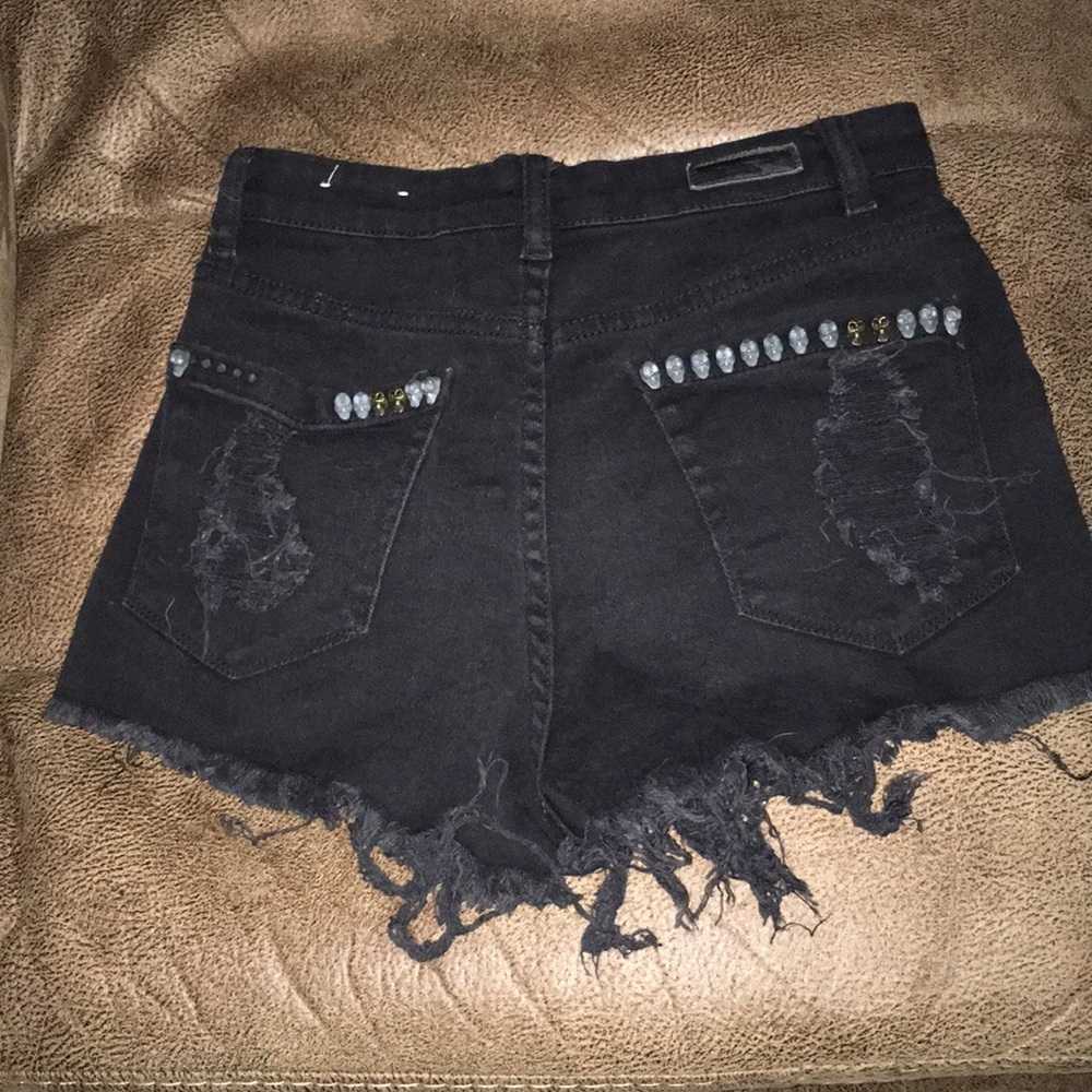 High waist distressed shorts with skull detail